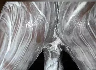 african dude slathers lotion over monster black cock and fat ass solo in bedroom stroking hard