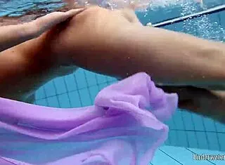 Aneta’s Big Tits Shine in Purple Pool Dress