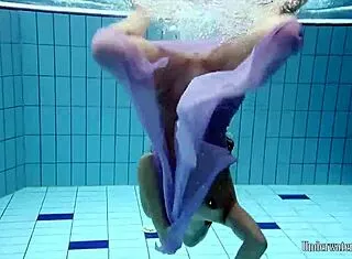 Aneta’s Big Tits Shine in Purple Pool Dress