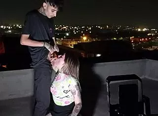 Skinny young goddess lets two hung guys worship ass on roof