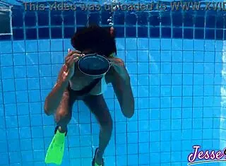 Petite Asian swims plugged then fingers gaping ass outdoors