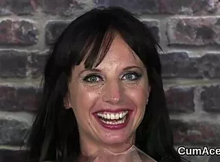 Cum hungry babe slurps face load after bukkake blowbang