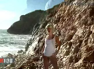 Nice blonde nicky wayne removes clothes by the sea