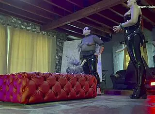 Dominatrix mistress april trains her bound slave hard.