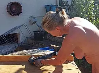 Granny is working naked in her garden today