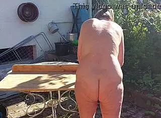 Granny is working naked in her garden today