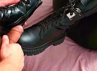 blonde milf uses boots and footjob
