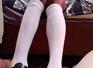 naked student in socks gives shoejob to teacher with vibrator