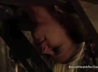submissive receives rough strap on
