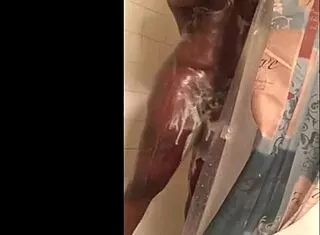 busty black chick with a dick showering