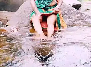 Villege aunty outdoor water fall bathing with dirty talks