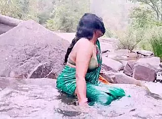 Villege aunty outdoor water fall bathing with dirty talks