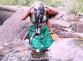 Villege aunty outdoor water fall bathing with dirty talks
