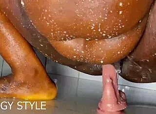 Curvy girl uses cucumber toy for wet squirt on bed