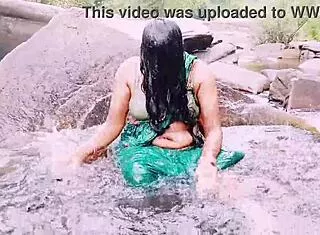 Villege aunty outdoor water fall bathing with dirty talks