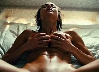 hot beautiful sexy woman having sex laying down on the bed