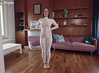 Brunette Tied In Tight Rope Bondage And Gagged