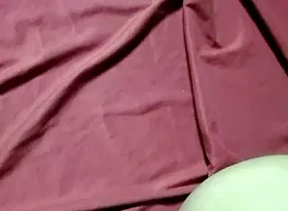 A girl tied up with red duct tape and gagging during a photo shoot