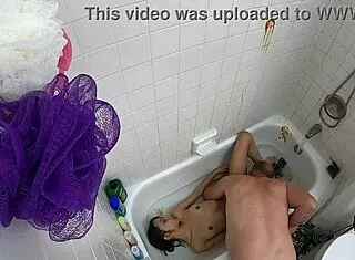 Teen 18+ asian girl in pool bathtub scene gets wet and wild