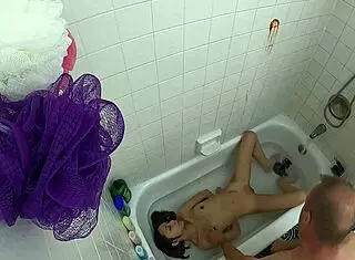 Teen 18+ asian girl in pool bathtub scene gets wet and wild