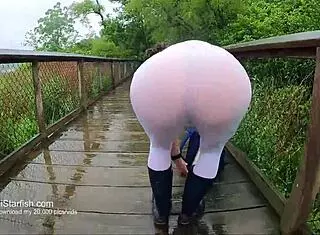 brunette milf flashes wet ass in leggings