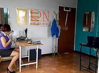 Nudist secretary flaunts her body in the office, teasing her boss with bold confidence.