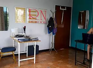 Nudist secretary flaunts her body in the office, teasing her boss with bold confidence.