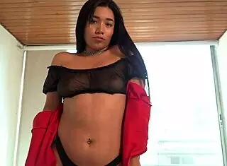 She fingers herself in the living room to a long orgasm.