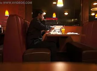 Indian guy eats American breakfast outdoors in public