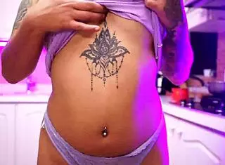 Abril Jones undresses in kitchen