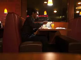 Indian guy eats American breakfast outdoors in public