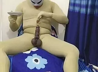 zentai slave gets into food fetish with bondage and cbt