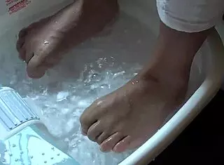 i enjoy a relaxing asian foot bath with wet toes and barefoot massage