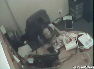 Blonde secretary fingers pussy at office desk