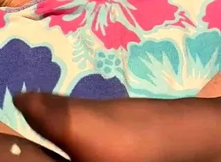 A milf gives a footjob in her black reinforced toe stockings.