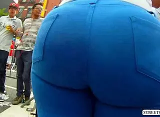 Beautiful brunette walks excitingly through the scene