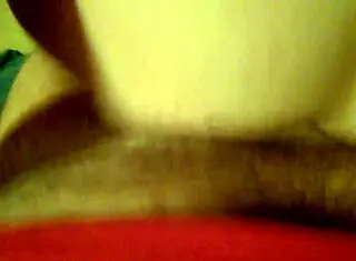 Amateur couple engages in passionate sex with pussy play and cumshot in homemade setting.