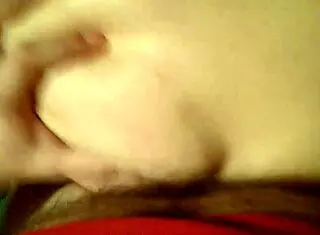 Amateur couple engages in passionate sex with pussy play and cumshot in homemade setting.