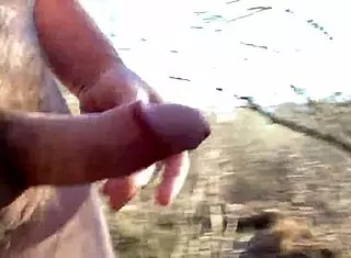 gay man masturbates on sunny boardwalk in public nature setting