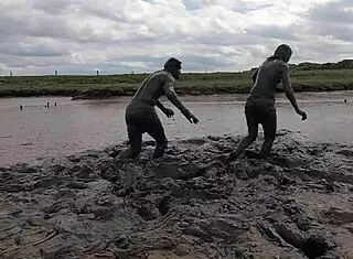 Mud wrestling: who wins, women or man in wet mess?
