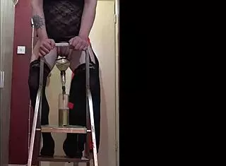 That crossdressing bisexual sissy loves tasting his own piss from the bottle on the ladder