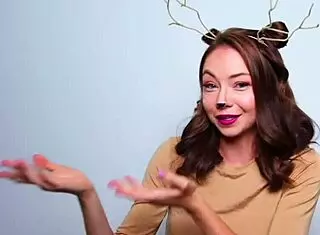 a girl wears a deer costume for the party