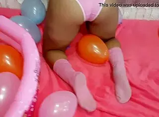 latina teen playing with balloon in reality