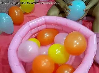latina teen playing with balloon in reality