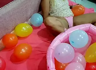 latina teen playing with balloon in reality
