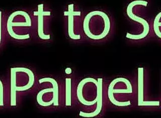 Kayla Paige strips on the sofa, playing with her pussy using toys.