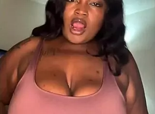 Big Lizz showcases her big boobs