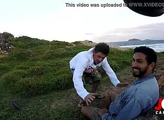 young girl giving blowjob on rocks by the sea