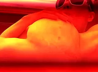 Redhead Gets Off In Public Tanning Bed With Voyeur Watching