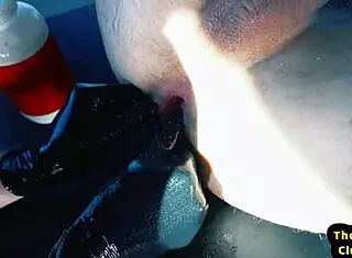 Gay muscle studs fisting hard in car with gloves and slick oil.